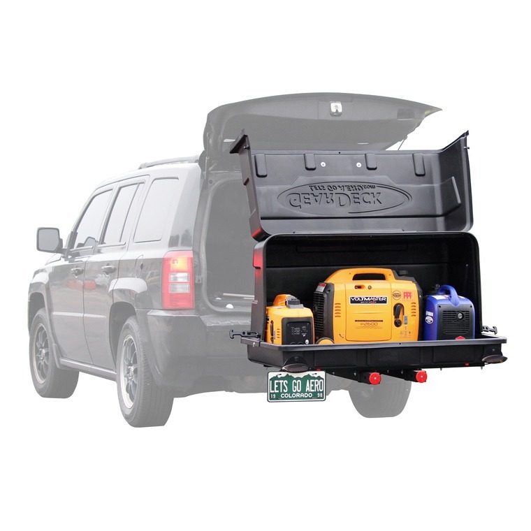 GearDeck cargo storage system mounted on SUV hitch, open lid revealing multiple portable generators inside